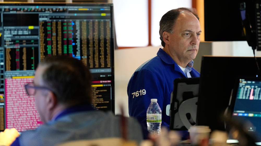 James Conti works on the floor at the New York Stock Exchange in New York, Thursday, Feb. 12, 2026. (AP Photo/Seth Wenig)