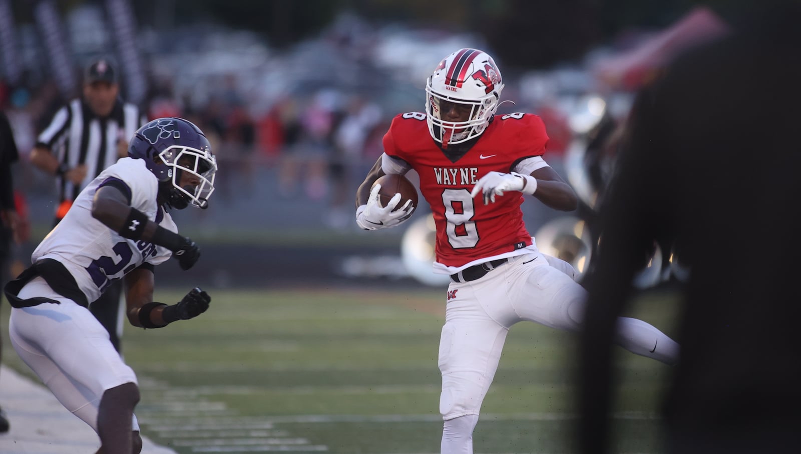 Wayne's Jamier Averette-Brown runs after a catch against Pickerington Central on Friday, Aug. 30, 2024, at Heidkamp Stadium in Huber Heights. David Jablonski/Staff