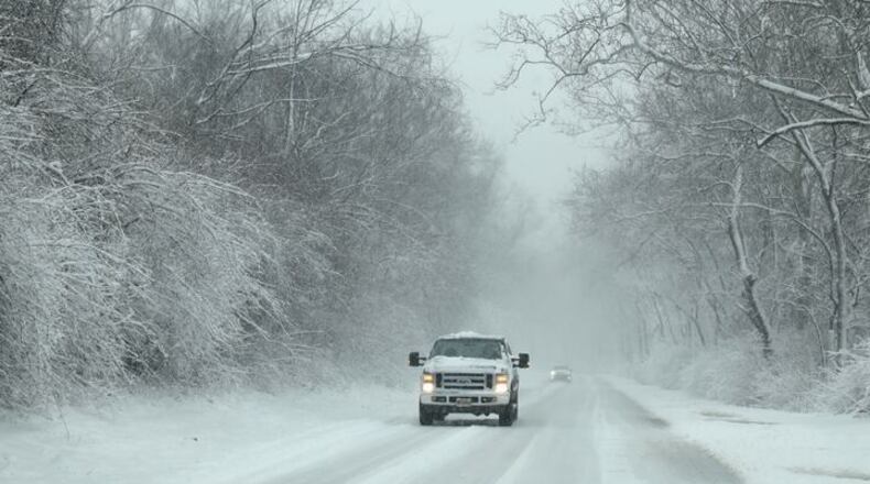 Winter dropped several inches of snow on the Huber Heights area. BILL LACKEY/STAFF