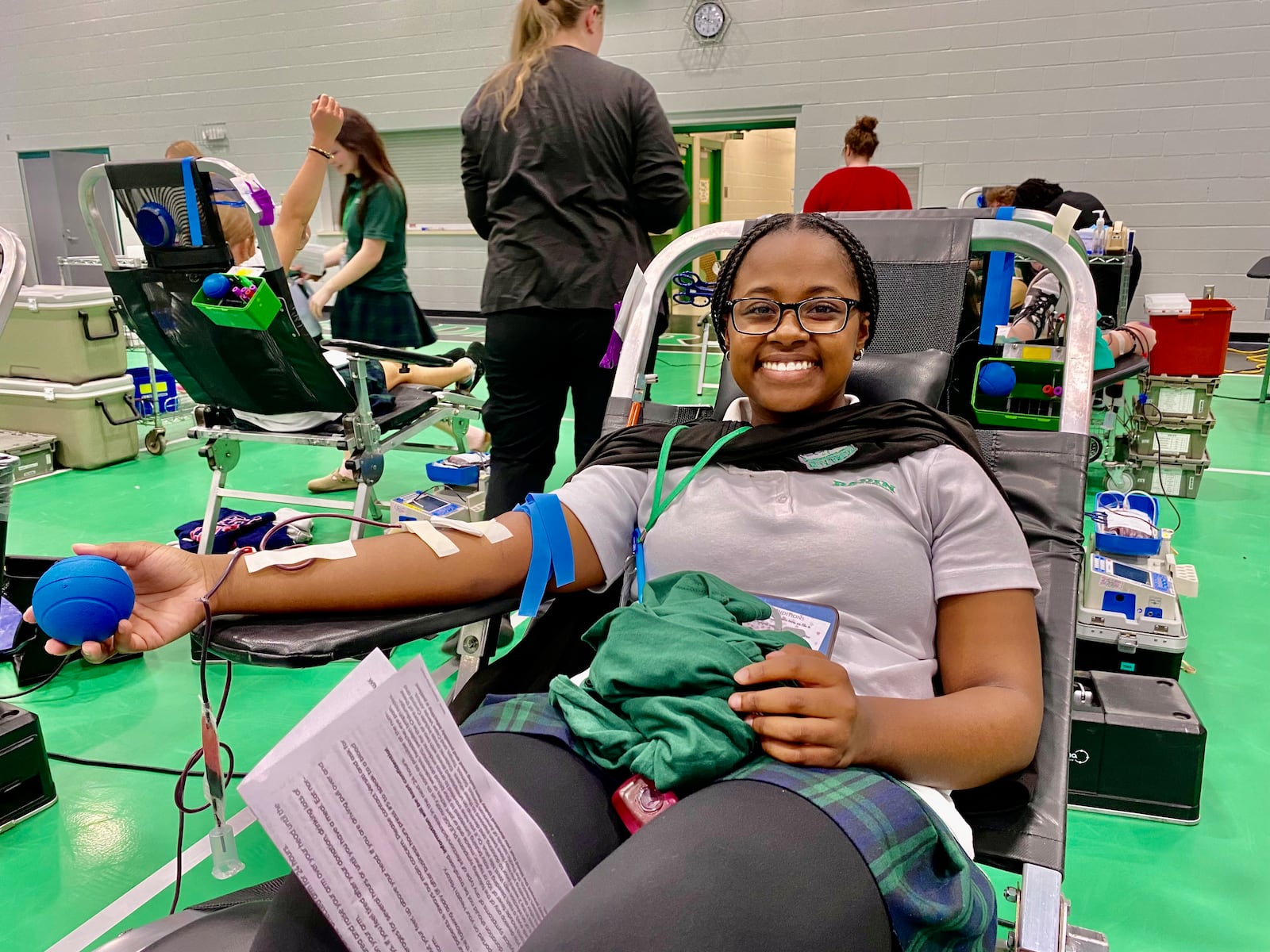 More than 100 students from Badin High School recently gave life-saving blood as part of the Hamilton school's semi-annual blood drive. Junior Olivia Harris was among the students to donate. (Photo By Michael D. Clark/Journal-News Contributor)