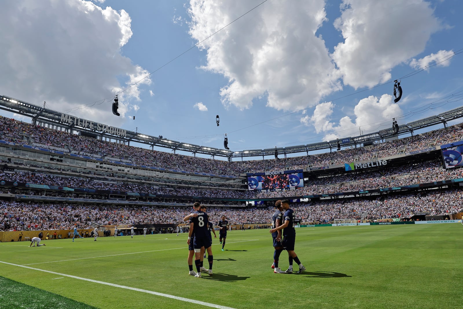 Paris Saint-Germain's Fabian Ruiz celebrates with team mates after scoring his side's third goal during the Club World Cup semifinal soccer match between PSG and Real Madrid in East Rutherford, N.J., Wednesday, July 9, 2025. (AP Photo/Adam Hunger)
