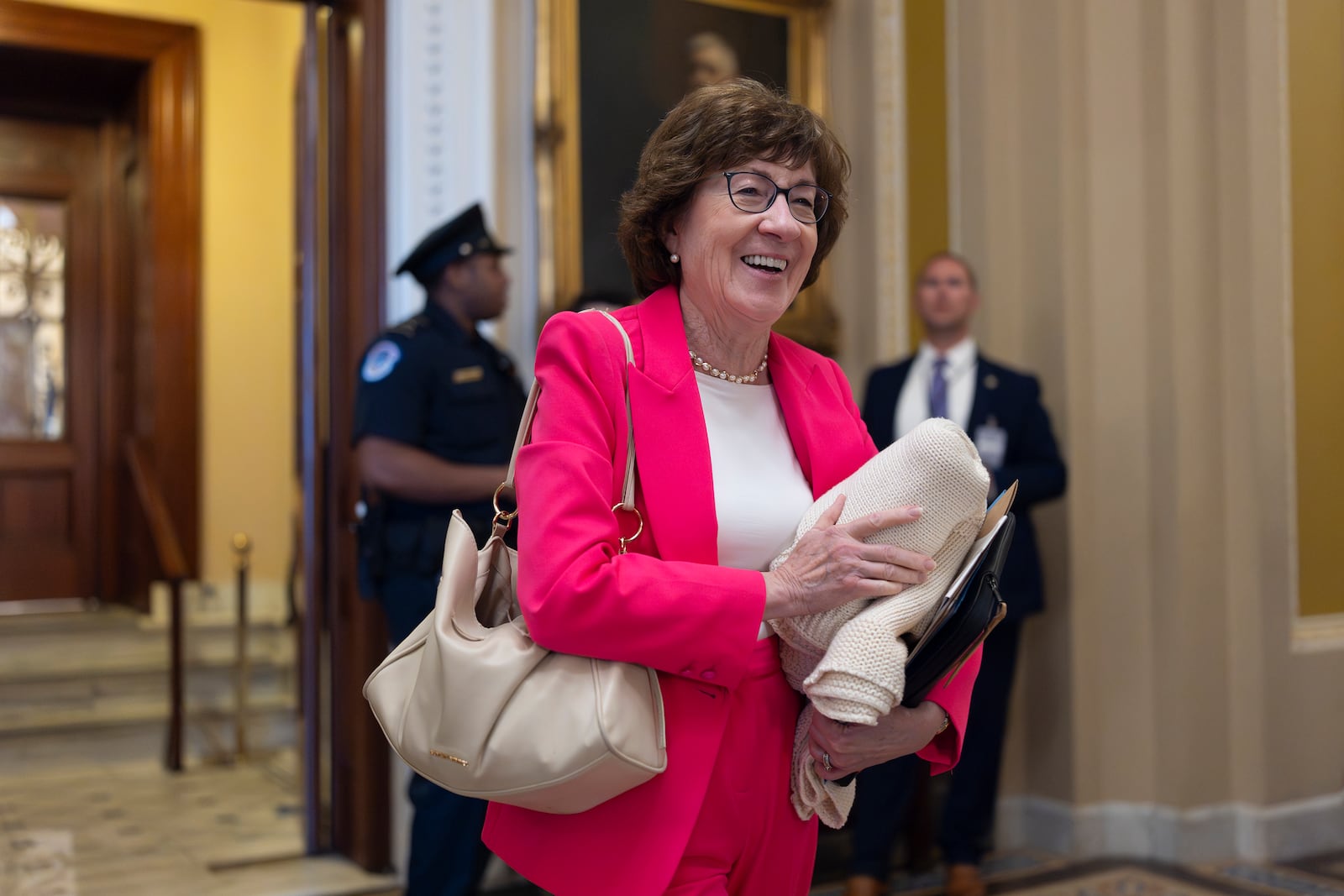 Sen. Susan Collins, R-Maine, chair of the Senate Appropriations Committee, walks from the chamber to his office as Majority Leader John Thune struggles with Republicans, like Collins, who are opposed to President Donald Trump's signature bill of big tax breaks and spending cuts, at the Capitol in Washington, Tuesday, July 1, 2025. (AP Photo/J. Scott Applewhite)