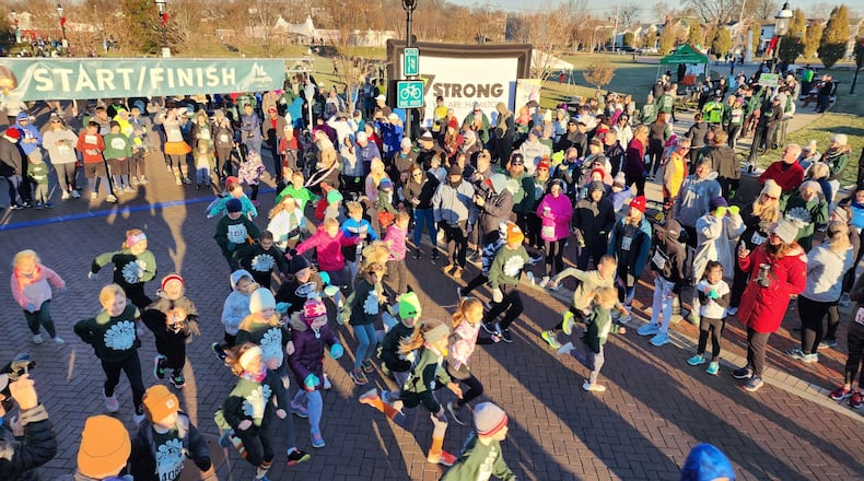 The Meyer Brothers and Sons Thanksgiving Day 5k for Young Lives was held Thursday, Nov. 24, 2022 in Hamilton. Thousands of runners, walkers and volunteers filled Marcum Park and downtown streets for the event. NICK GRAHAM/STAFF