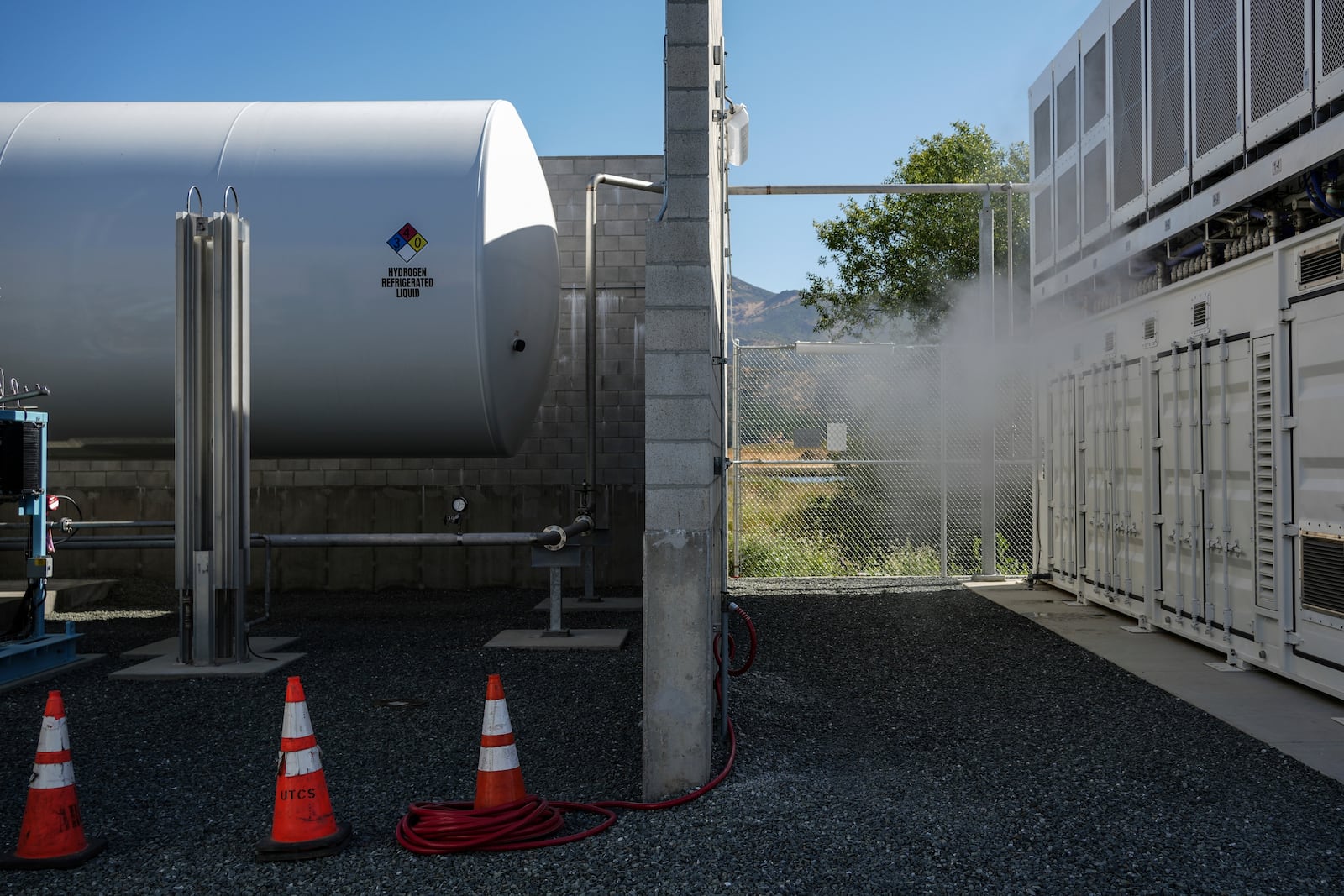 A tank that holds liquid hydrogen, left, which is converted to gas to run the fuel cells, sits at at Energy Vault, a company that is creating an emergency power system that relies on hydrogen and battery storage, on Tuesday, May 27, 2025, in Calistoga, Calif. (AP Photo/Annika Hammerschlag)