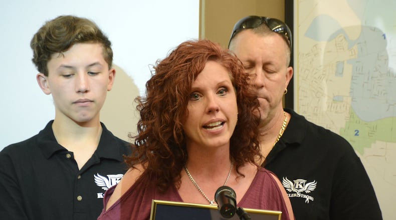 Fairfield Twp. trustees proclaimed May 17 every year as “Kyler Bradley (DIPG) National Awareness Day” in the township. Ohio has proclaimed every May 17 as “Diffuse Intrinsic Pontine Glioma Awareness Day” in the state. Pictured is Rebecca Bradley, with her husband Anthony Kirk (back right) and their son Kirk, speaking during the May 9, 2018, Fairfield Twp. Trustee meeting. MICHAEL D. PITMAN/STAFF