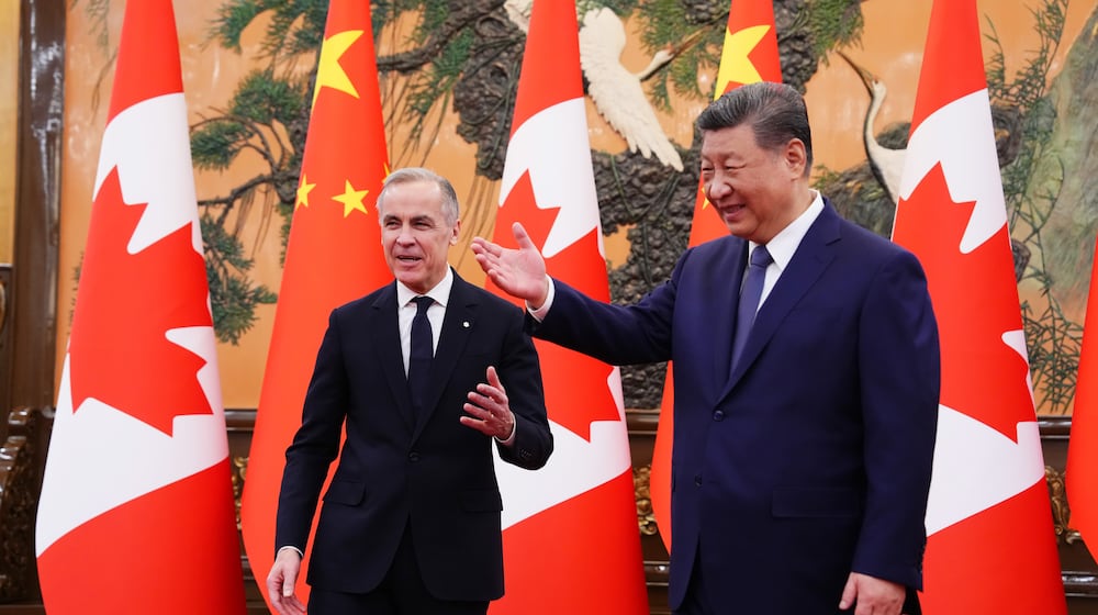 Canadian Prime Minister Mark Carney, left, meets with President of China Xi Jinping at the Great Hall of the People in Beijing, China, on Friday, Jan. 16, 2026. (Sean Kilpatrick/The Canadian Press via AP)