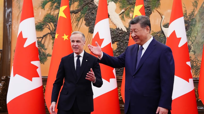 Canadian Prime Minister Mark Carney, left, meets with President of China Xi Jinping at the Great Hall of the People in Beijing, China, on Friday, Jan. 16, 2026. (Sean Kilpatrick/The Canadian Press via AP)