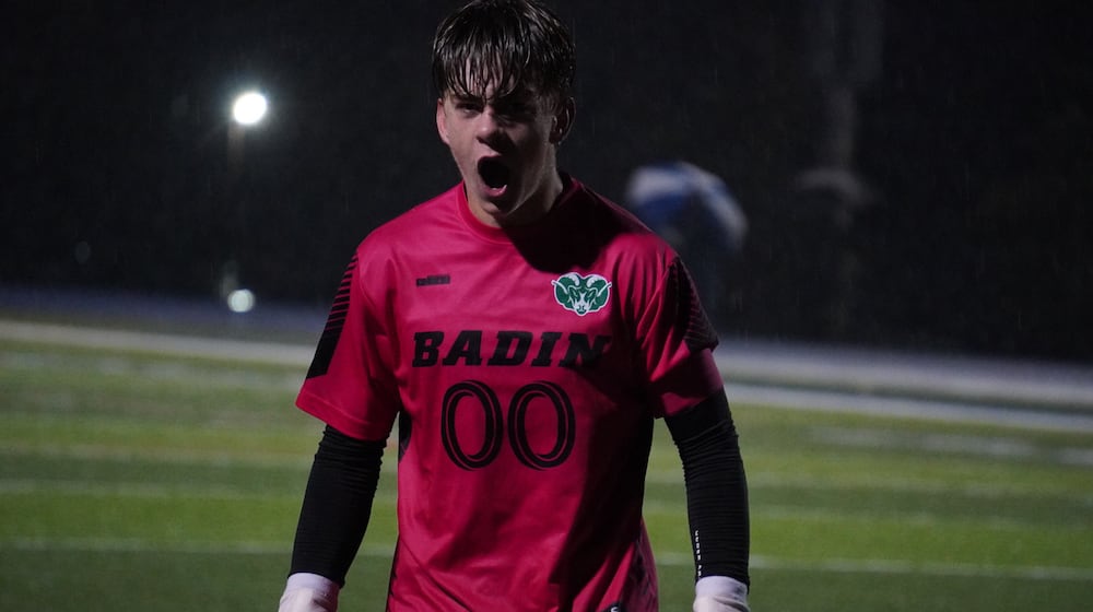 Badin goalkeeper Cole Parr celebrates after batting away a Carroll penalty kick during their Division III regional semifinal on Wednesday night at Williamsburg. CHRIS VOGT / CONTRIBUTED