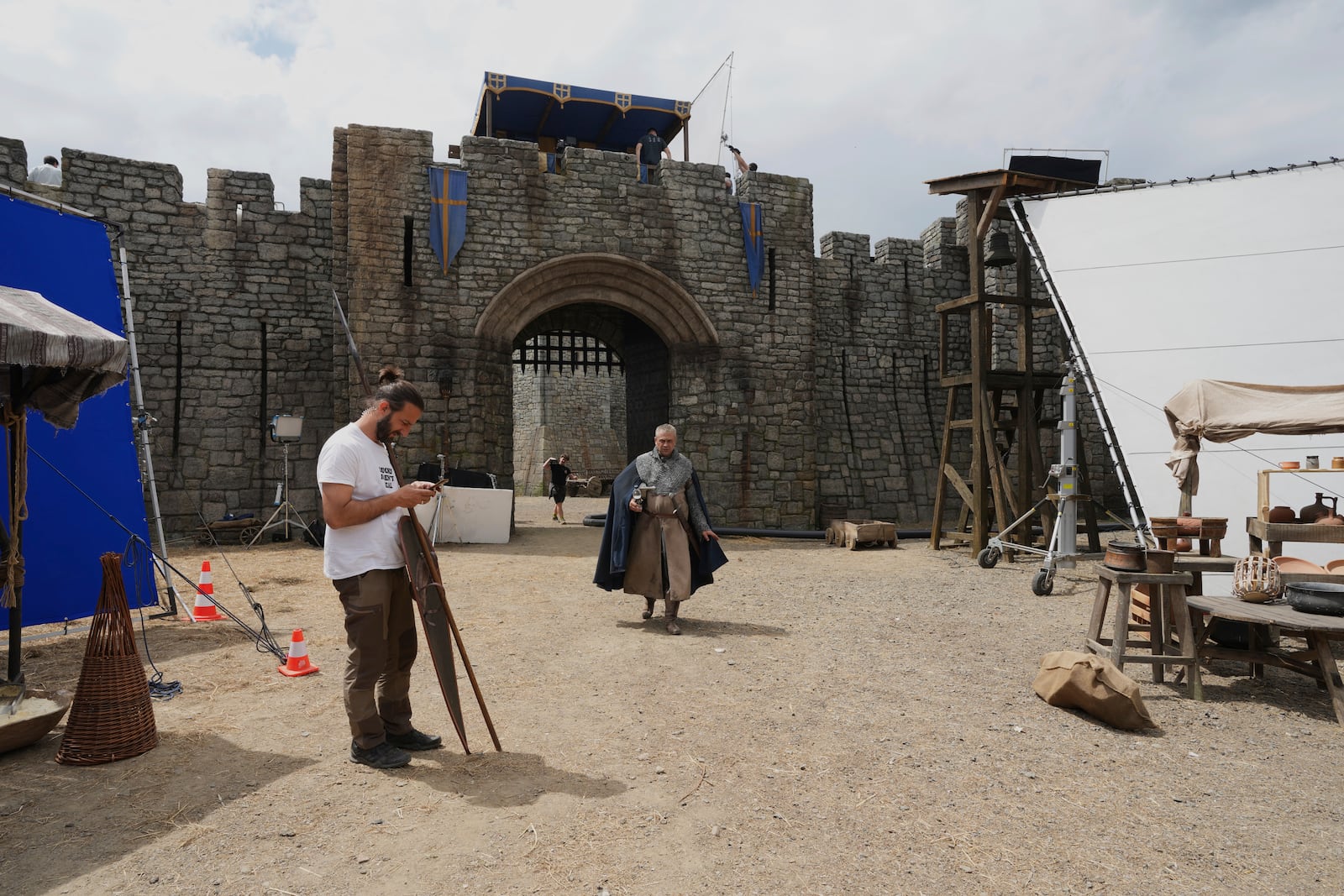 Workers and artists on the set of the Robin Hood ten-episode series, in Belgrade, Serbia, Monday, May 5, 2025. (AP Photo/Darko Vojinovic)