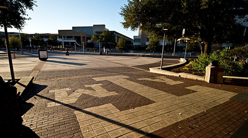 FILE - The sun sets over Texas A&M Campus, just outside Rudder Tower, Feb 12, 2016, in College Station, Texas. (Timothy Hurst/College Station Eagle via AP, File)