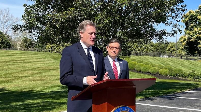 U.S. Rep. Mike Turner, R-Dayton, at the podium, with Speaker of the House Mike Johnson outside the Hope Hotel and Conference Center earlier this year. THOMAS GNAU/STAFF