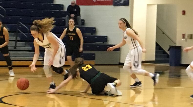 Edgewood’s Zoe Stephen (2) gets the ball away from Little Miami’s Kaitlyn Simpkins (23) and heads the other way Saturday afternoon at Ron Kash Court in St. Clair Township. RICK CASSANO/STAFF