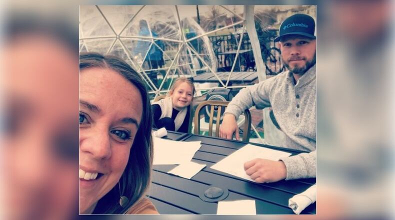 Robin and Jonathan Szary, with daughter Harper Szary, 7, enjoyed dining in an Igloo at Tano Bistro in Hamilton, something Harper called "magical." PROVIDED