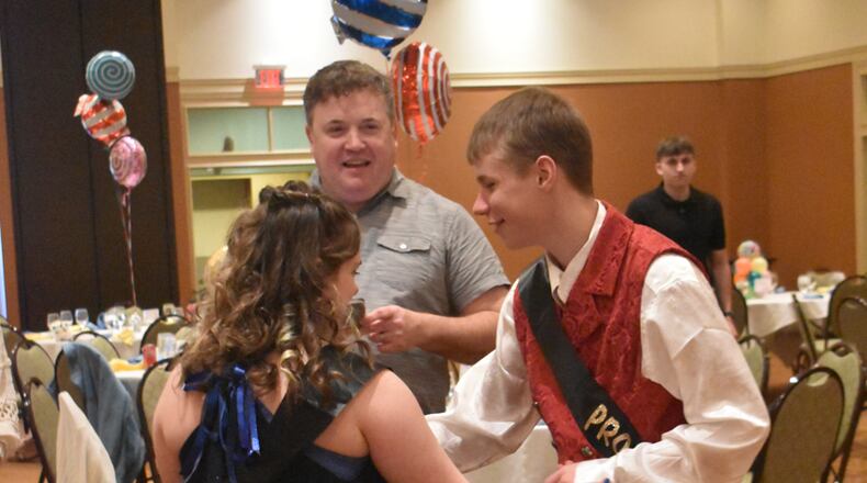 PHOTO CUTLINE: A veteran Edgewood High School teacher has won a top county award for this work with special needs students. Business and Marketing Instructor Rocky Chasteen, who works for Butler Tech at the high’s school satellite program of the career school, was recently announced as this year’s winner of the Community Impact Award from the Butler County Board of Developmental Disabilities. Chasteen is pictured with students at last spring’s Day Prom dance conducted each year by the high school. CONTRIBUTED