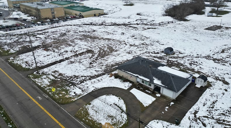 Badin High School is proceeding with its parking lot expansion, and Hamilton City Council amended the plan by changing the zoning of 625 New London Road to be included in the parking lot expansion project. NICK GRAHAM/STAFF