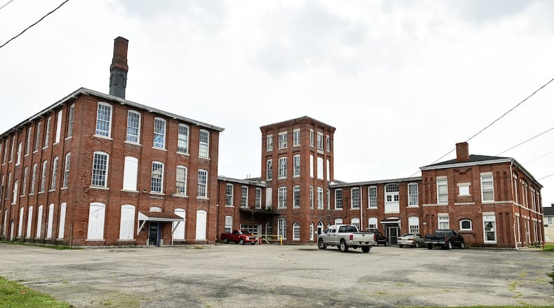 The Shuler & Benninghofen Woolen Mills building at corner of Williams Avenue and Pleasant Avenue is one of several buildings of interest as students at Miami University try to develop a Pleasant Avenue Revitalization Strategy for Lindenwald to revitalize the Hamilton neighborhood. NICK GRAHAM/STAFF