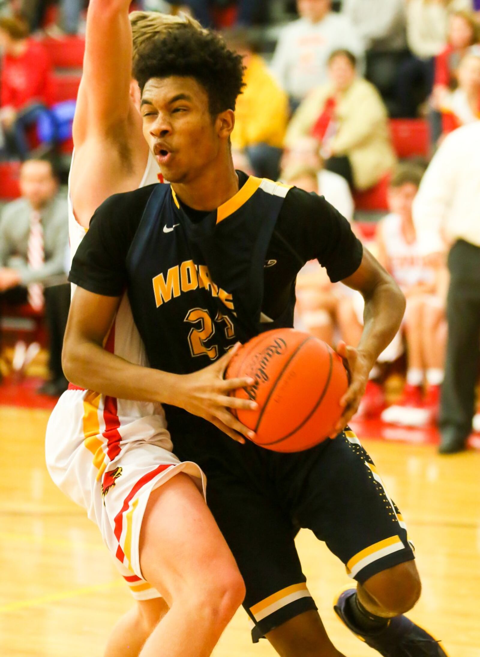 Monroe forward Tristan Backas (23) drives the lane during Tuesday night’s game at Fenwick. GREG LYNCH/STAFF