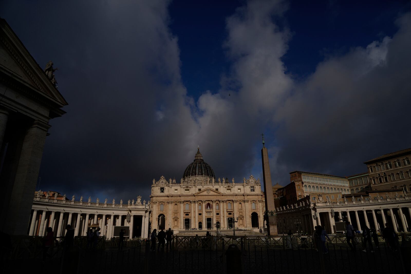 Clouds pass over the St. Peter Basilica at the Vatican, Tuesday, May 6, 2025. (AP Photo/Gregorio Borgia)