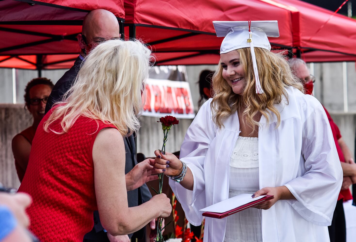 Madison High School drive-thru graduation ceremony at Land of Illusion