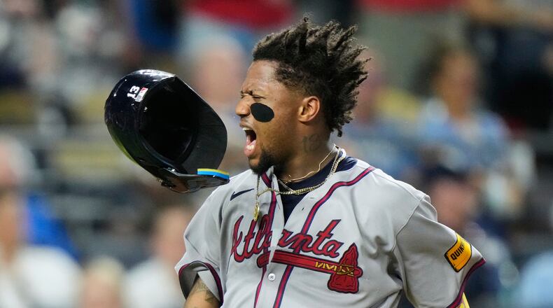Atlanta Braves' Ronald Acuna Jr. celebrates after scoring on a three-run double hit by Austin Riley during the eighth inning of a baseball game against the Kansas City Royals, Monday, July 28, 2025, in Kansas City, Mo. (AP Photo/Charlie Riedel)