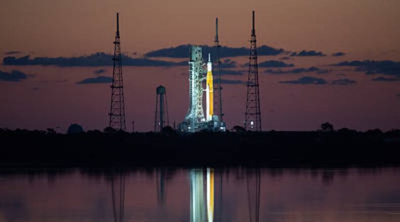 NASA’s Space Launch System (SLS) rocket with the Orion spacecraft aboard is seen at sunrise atop a mobile launcher at Launch Complex 39B, Monday, April 4, 2022, as the Artemis I launch team conducts the wet dress rehearsal test at NASA’s Kennedy Space Center in Florida. Ahead of NASA’s Artemis I flight test, the wet dress rehearsal will run the Artemis I launch team through operations to load propellant, conduct a full launch countdown, demonstrate the ability to recycle the countdown clock, and drain the tanks to practice timelines and procedures for launch. Photo Credit: (NASA/Joel Kowsky)
