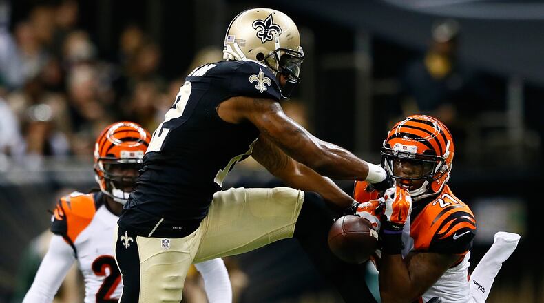 NEW ORLEANS, LA - NOVEMBER 16: Dre Kirkpatrick #27 of the Cincinnati Bengals nearly picks off a pass intended for Marques Colston #12 of the New Orleans Saints during the second half at Mercedes-Benz Superdome on November 16, 2014 in New Orleans, Louisiana. (Photo by Kevin C. Cox/Getty Images)