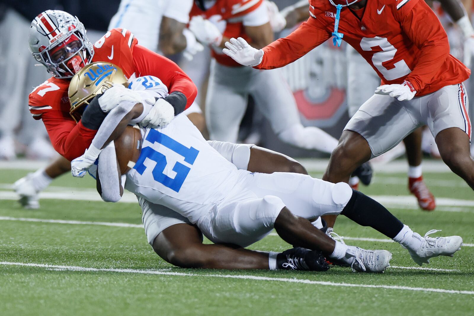 Ohio State defensive lineman Kenyatta Jackson, top, tackles UCLA running back Jaivian Thomas during the first half of an NCAA college football game, Saturday, Nov. 15, 2025, in Columbus, Ohio. (AP Photo/Jay LaPrete)