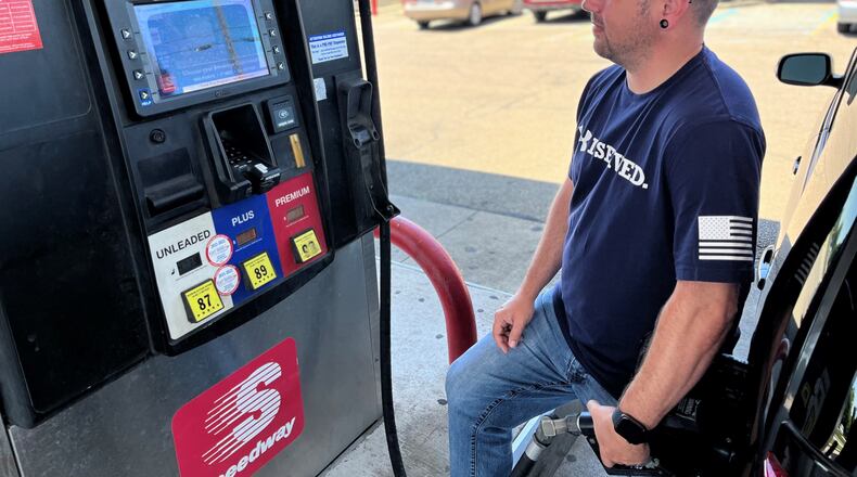 Dustin Shepherd, 36, of Miamisburg, fills up at a Speedway gas station in Dayton on Friday. Regular unleaded gas cost $4.79 at some local stations. CORNELIUS FROLIK / STAFF