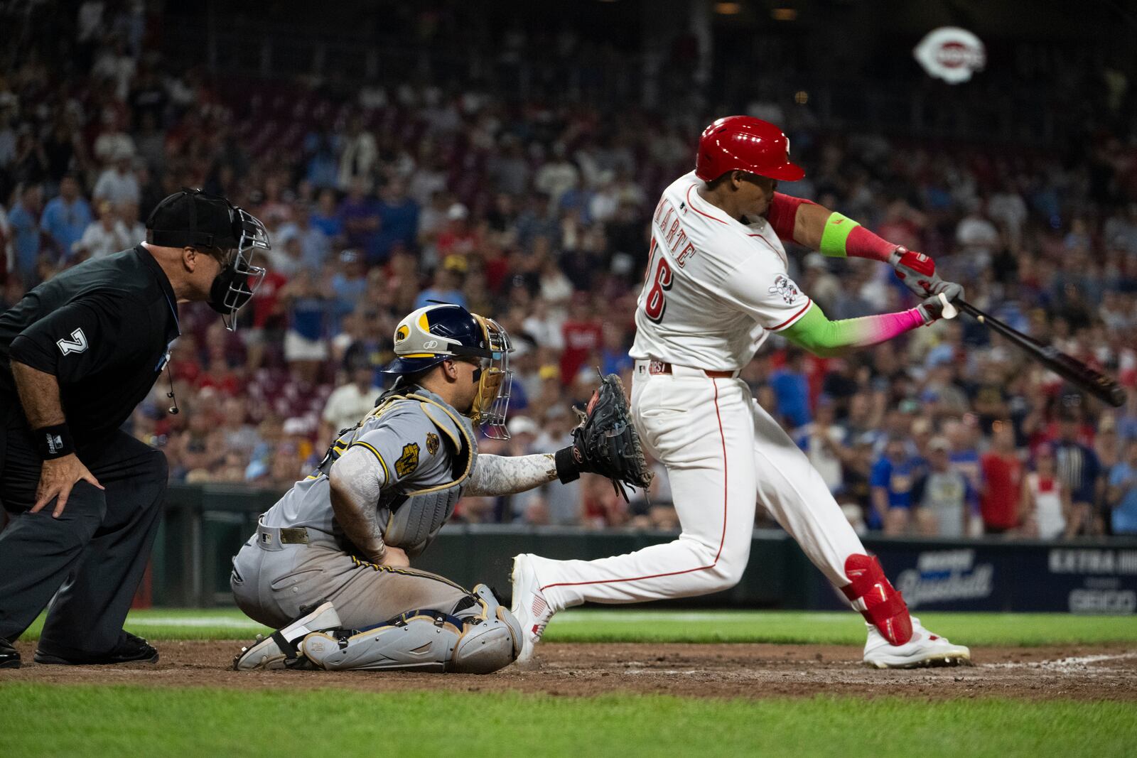 Cincinnati Reds Noelvi Marte (16) hits a home run in the 11th inning of a baseball game against the Milwaukee Brewers, Saturday, Aug. 16, 2025, in Cincinnati. (AP Photo/Michael Swensen)