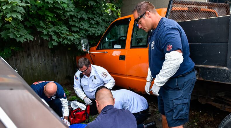 The heroin/opioid epidemic has cost Middletown taxpayers more than $2.3 million in 2017. Middletown paramedics and police officers responded to a drug overdose behind the Midd-Town Carry Out on Central Avenue Monday, June 26 in Middletown. Emergency personnel found a man unconscious, lying between two vehicles across the alley. Paramedics first tried to start an IV, the fastest and most effective way to push Narcan into the mans system, and when that failed, Narcan was administered through the mans nose. Then a second IV was started. The entire time, paramedics bagged the gentleman until his oxygen level returned to normal. Two doses of Narcan, twice the normal amount, were used to revive the man, who was transported to Atrium. FILE PHOTO