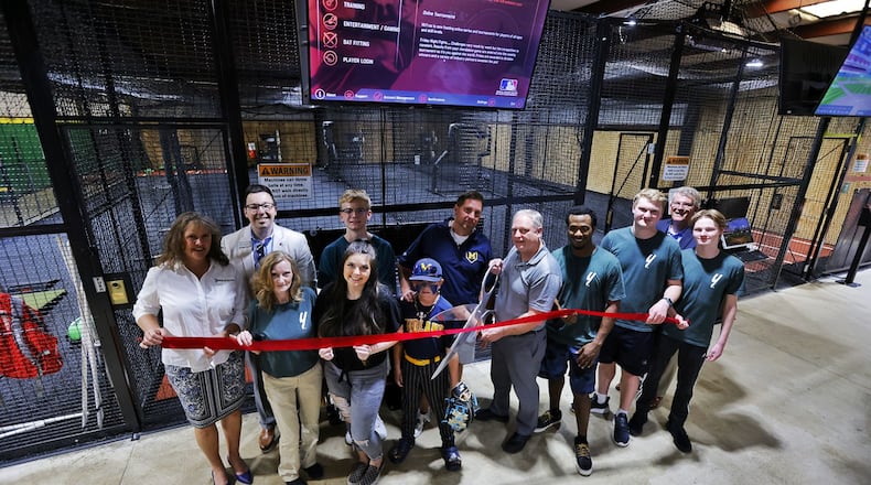 The Yard sports development held their grand opening and ribbon cutting Wednesday, May 8, 2024 on Commerce Drive in Middletown. The new baseball and softball batting cage and training facility offers batting cages with HitTrax training system, pitching and batting training, pitching machines and more. NICK GRAHAM/STAFF