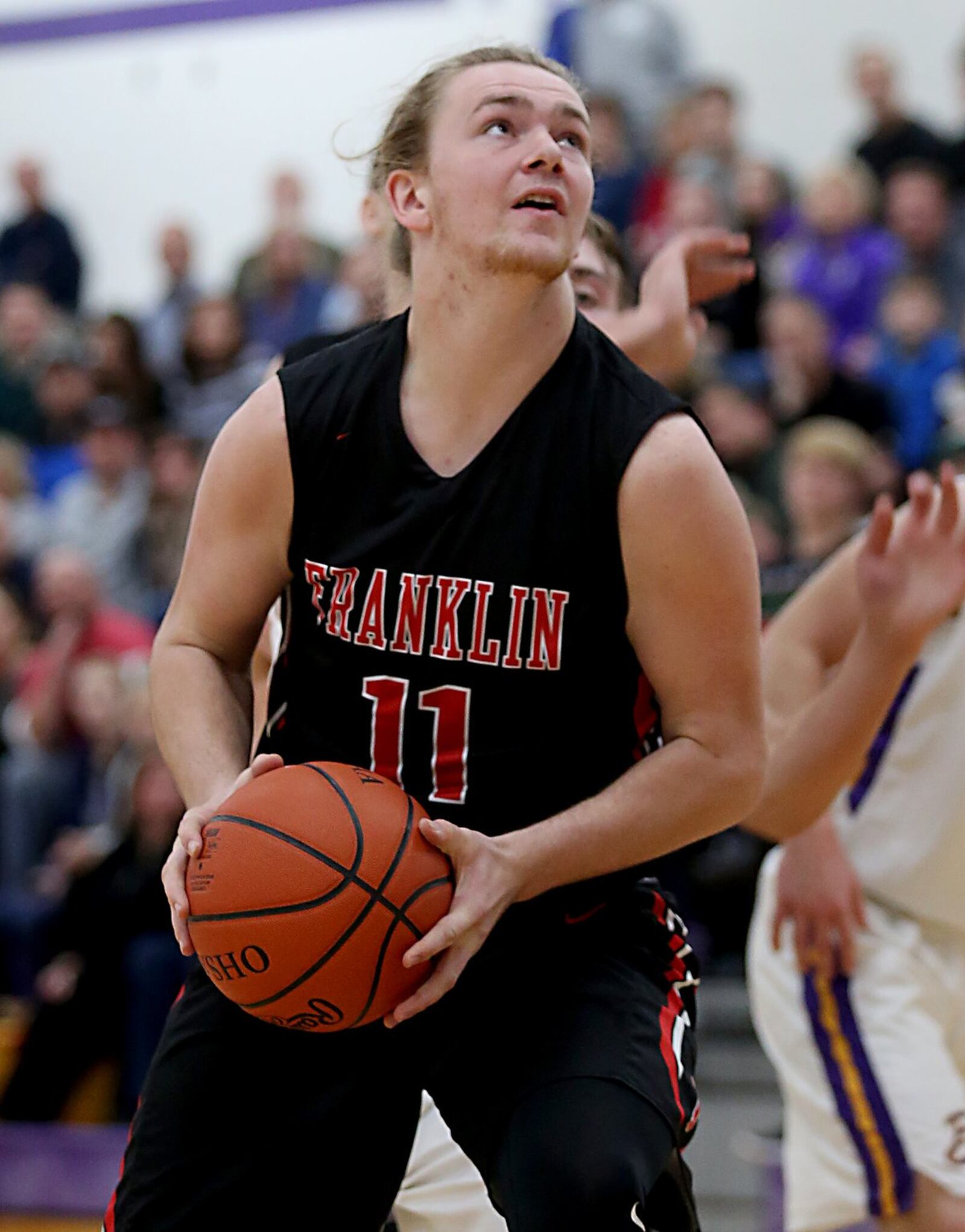 Franklin forward Braden White goes back up with a rebound during Friday night’s game at Bellbrook. CONTRIBUTED PHOTO BY E.L. HUBBARD
