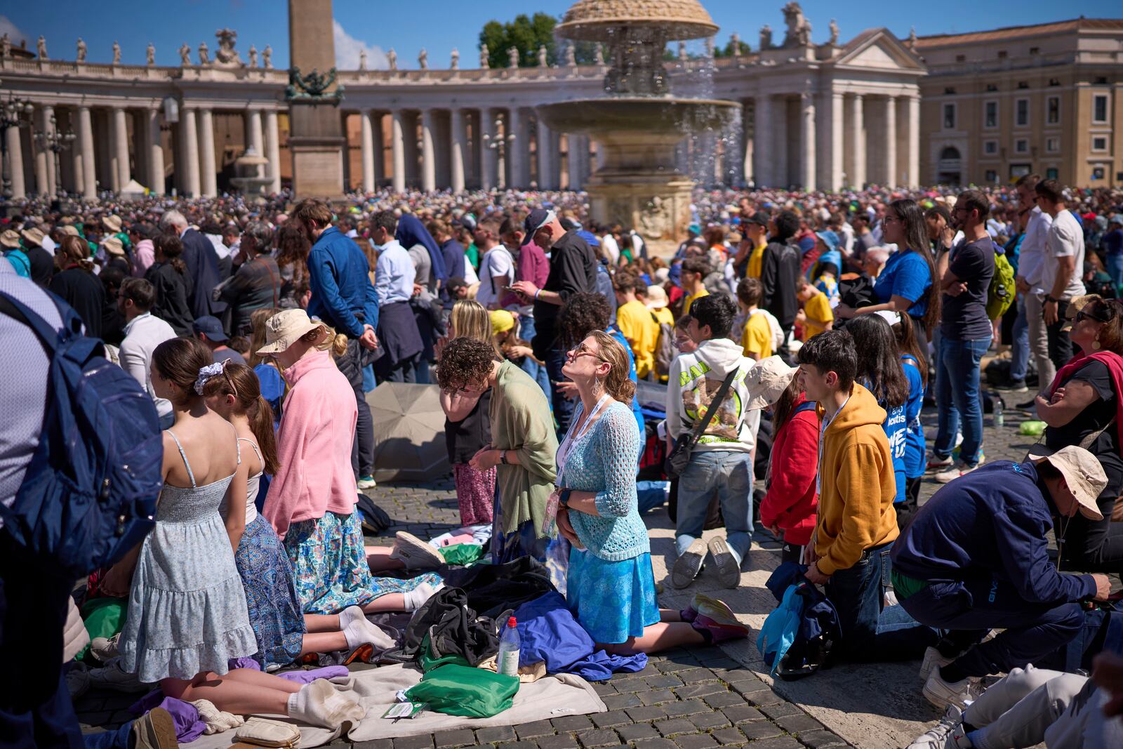Faithful pray during the funeral of Pope Francis in St. Peter's Square at the Vatican, Saturday, April 26, 2025. (AP Photo/Emilio Morenatti)