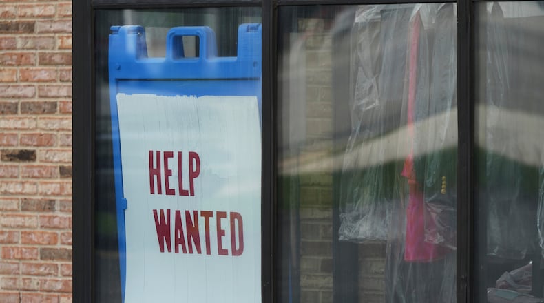 FILE - "Help Wanted" sign is displayed at a dry cleaner in Rolling Meadows, Ill., Thursday, May 15, 2025. (AP Photo/Nam Y. Huh, file)