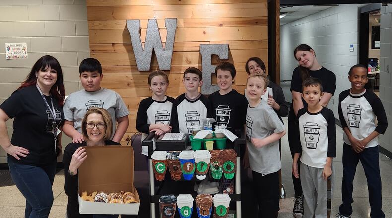 Lakota students are getting their entrepreneurial lessons on wheels by running snack carts for teachers and classmates. The rolling business exposure is proving both enlightening and useful for students and staffers, said Lakota teachers overseeing the program. Pictured is the snack cart crew at Woodland Elementary. CONTRIBUTED