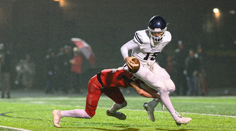 Valley View High School junior quarterback Brody Gibbs is tackled by Indian Hill's Joey Jernigan during their game on Friday, Nov. 21, 2025 at Fairfield's Alumni Stadium. Indian Hill won 41-14. JEREMY MILLER / CONTRIBUTED PHOTO