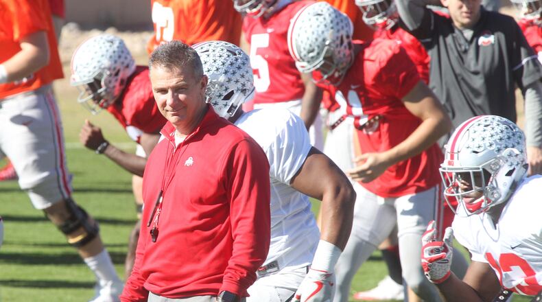 Ohio State's Urban Meyer watches the Buckeyes during a Fiesta Bowl practice at Notre Dame Prep Academy in Scottsdale, Ariz., on Tuesday, Dec. 27, 2016. David Jablonski/Staff