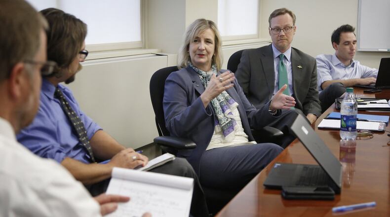 New Wright State University President Cheryl B. Schrader takes questions from content editors at Cox Media Group Ohio. Beside her is university spokesman Seth Baugess. TY GREENLEES / STAFF
