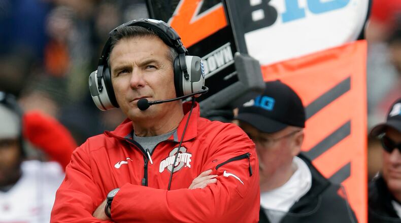 FILE - In this Nov. 2, 2013, file photo, Ohio State head coach Urban Meyer watches from the sideline during the second half of an NCAA college football game against Purdue in West Lafayette, Ind. Ohio State tied a previous school record with a quintet of players selected in the first round Thursday night, April 28, 2016, in Chicago. (AP Photo/Michael Conroy, File)