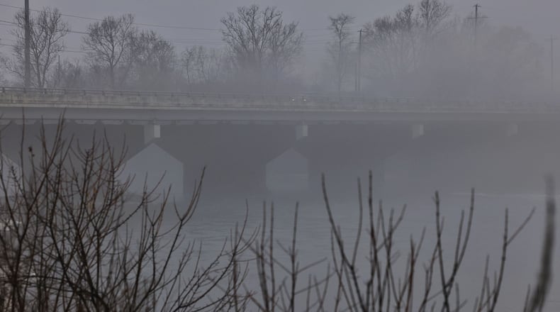Morning fog caused decreased visibility around the county Wednesday morning, Jan. 24, 2024. This is the Oxford State Road bridge crossing the Great Miami River. NICK GRAHAM/STAFF