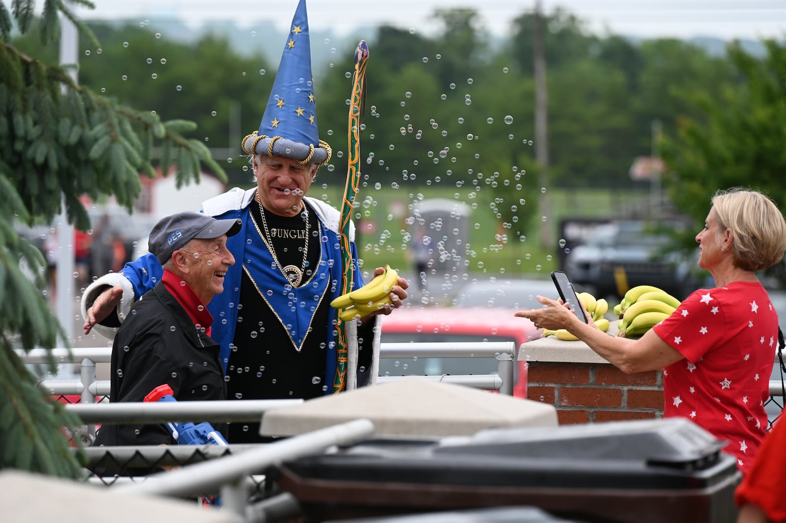 Some of the members of the Savannah Bananas and Texas Tailgaters stopped by the Joe Nuxhall Miracle League Fields on Saturday morning, June 14, 2025, in Fairfield while in Cincinnati for a pair of games at Great American Ball Park in downtown Cincinnati. Pictured is "Jungle" Jim Bonaminio with famed local pitchman Ed Hartman ahead of the arrival of the Bananas and the Tailgaters. MICHAEL D. PITMAN/STAFF