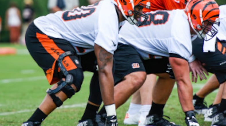 Offensive tackle Cedric Ogbuehi gets ready for the snap on the first day of the Cincinnati Bengals training camp on her birthday Friday, July 29 at their practice fields near Paul Brown Stadium in Cincinnati. NICK GRAHAM/STAFF