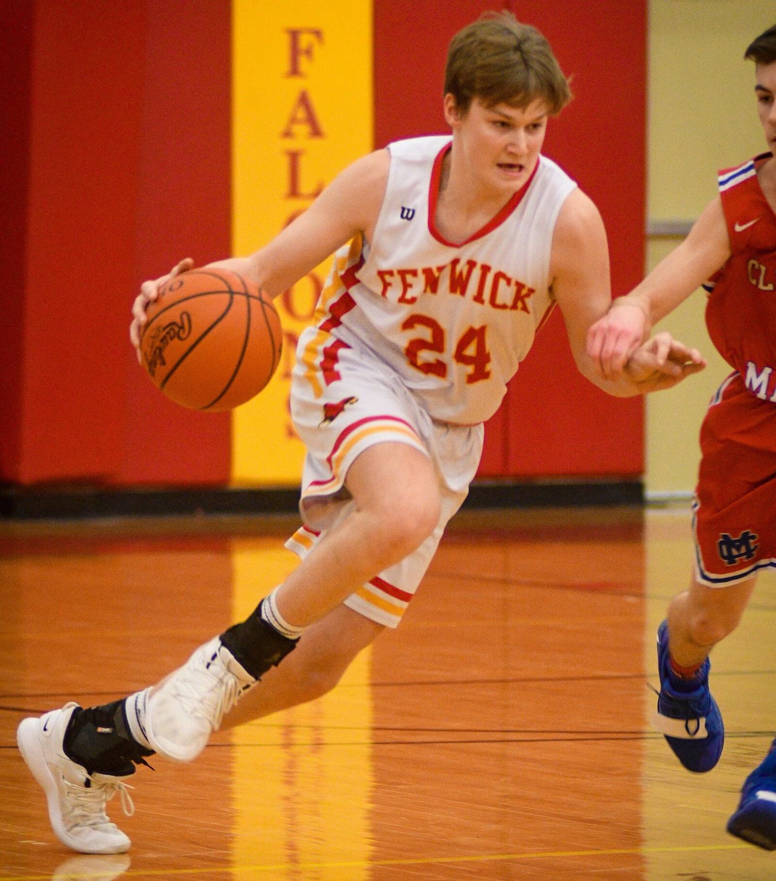 Fenwick’s Dan Luers (24) drives up the floor during Monday night’s game against Clinton-Massie at Fenwick. The host Falcons won 67-48. ROB MCCULLEY/RAM PHOTOGRAPHY