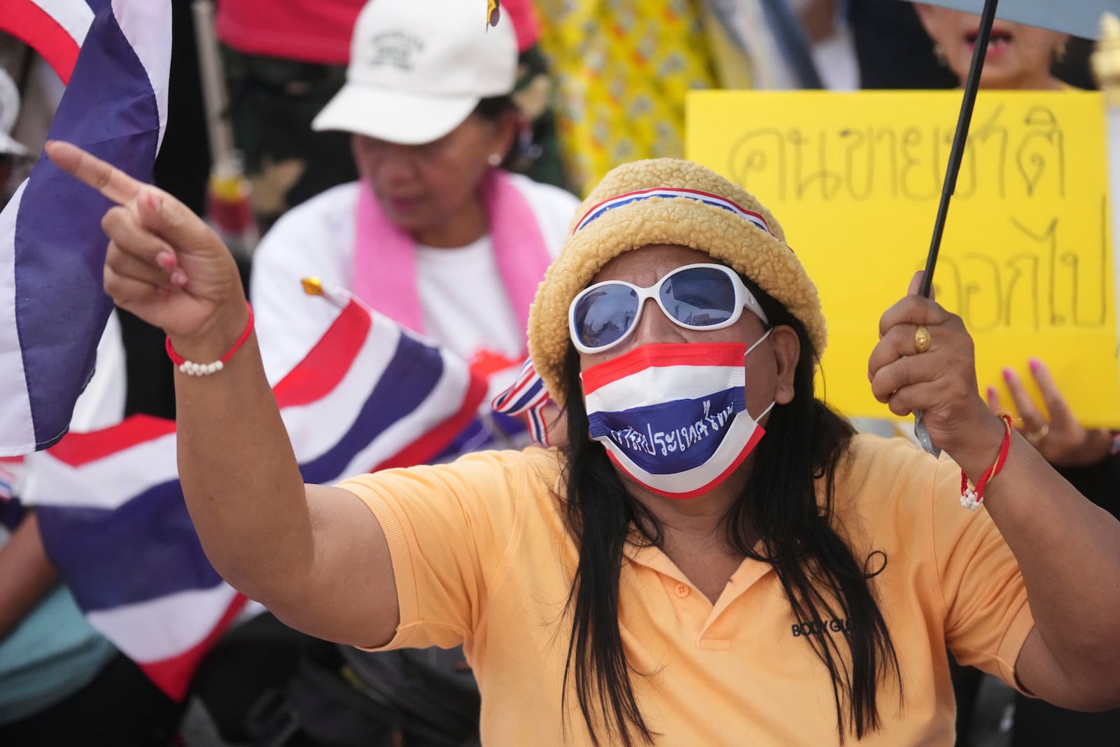 Protesters gather at Victory Monument demanding Thailand's Prime Minister Paetongtarn Shinawatra resign in Bangkok, Thailand, Saturday, June 28, 2025. (AP Photo/Sakchai Lalit)