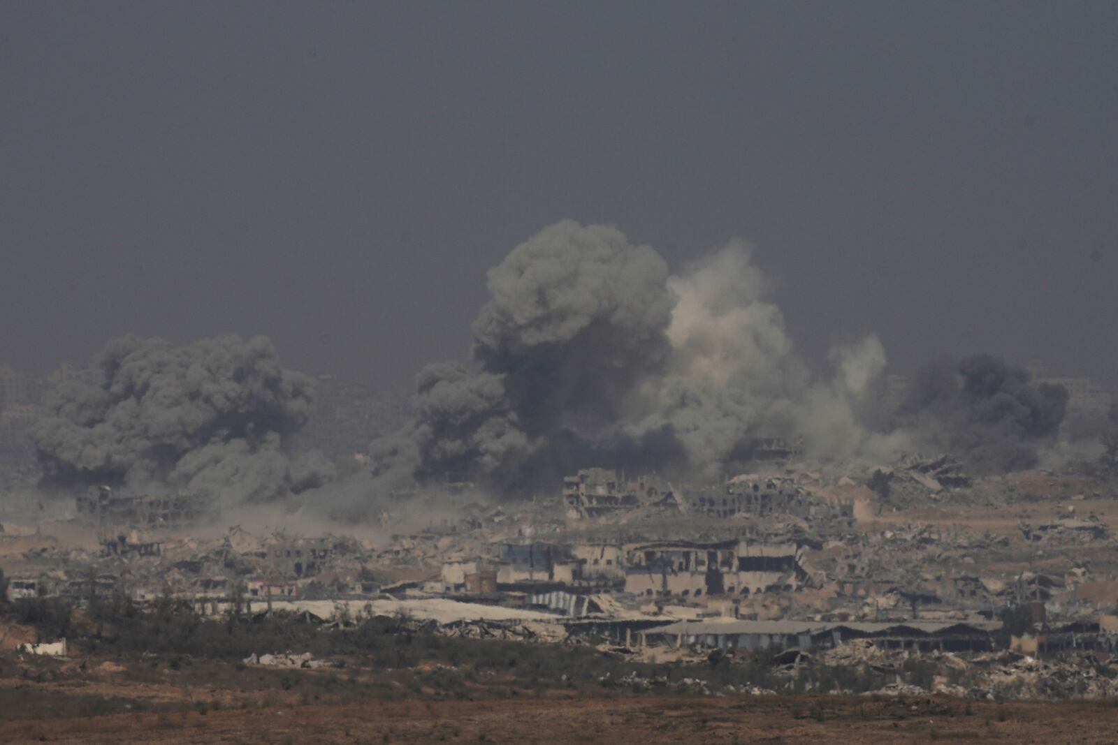 Smoke rises from an explosion in the northern Gaza Strip, as seen from southern Israel Sunday, July 27, 2025. (AP Photo/Ohad Zwigenberg)
