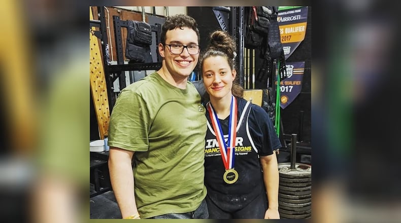 Christa Baumgartner is shown with her fiancé, Jake Dankert, at the amateur women’s weightlifting competition where she was credited with a total lift of 1,060 pounds for three events. CONTRIBUTED