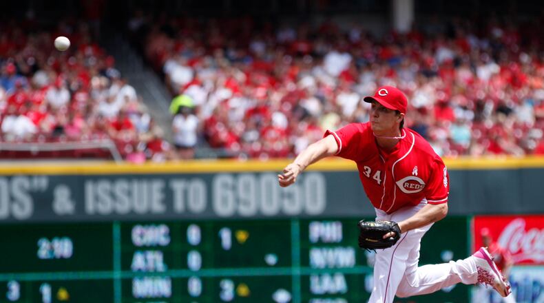 Reds starter Homer Bailey pitches against the Rockies on Sunday, May 11, 2014, at Great American Ball Park in Cincinnati. David Jablonski/Staff