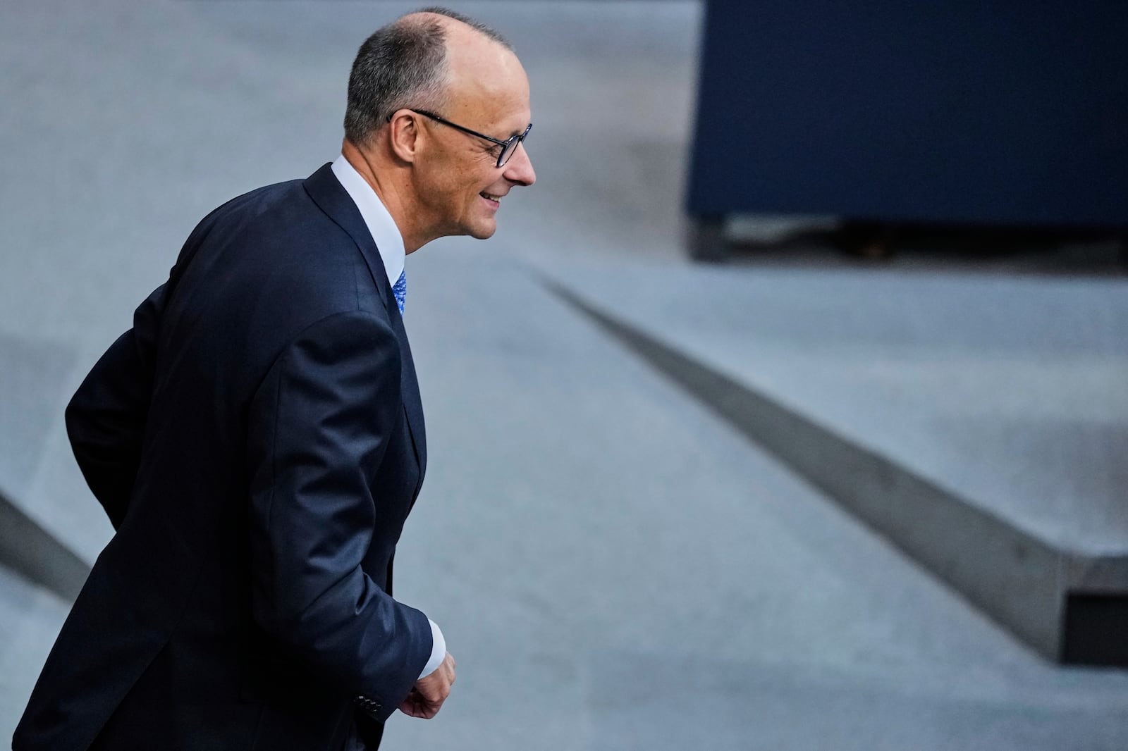 Friedrich Merz waits for the beginning of a session where he is supposed to be elected new Chancellor in the parliament Bundestag in Berlin, Tuesday, May 6, 2025. (AP Photo/Ebrahim Noroozi)