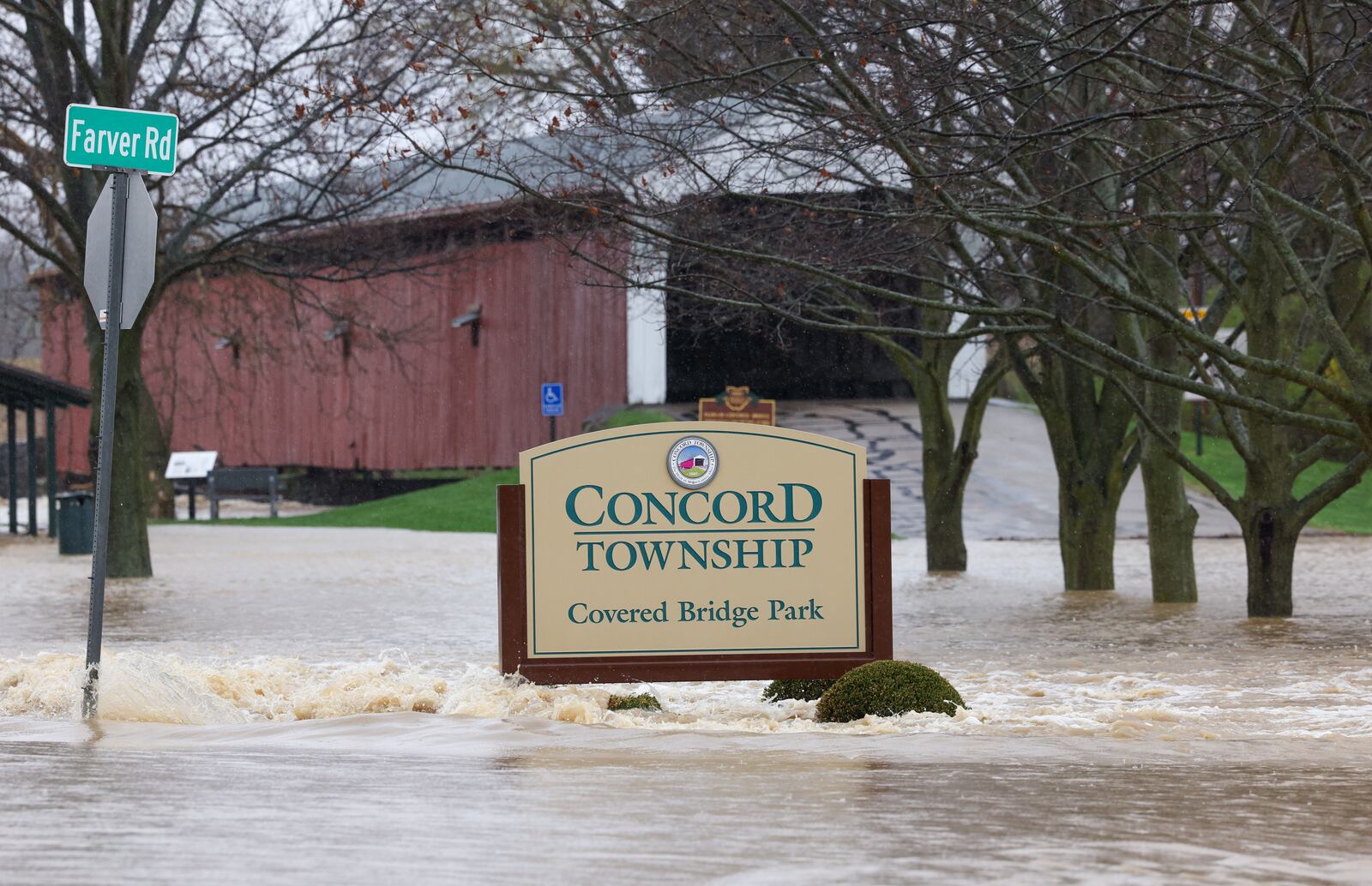 Flooding from the Great Miami River blocked off Eldean Road and Concord Township Covered Bridge Park, along with nearby baseball fields, on Saturday north of Troy near North County Road 25A. Eldean Road was closed on both sides of County Road 25A due to flooding. BRYANT BILLING/STAFF
