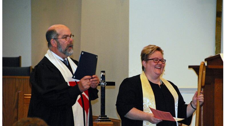 The Rev. Stephen Bentley, associate regional minister of Christian Church in Ohio, installs the Rev. Tracy Siegman as senior pastor at First Christian Church, Middletown. CONTRIBUTED